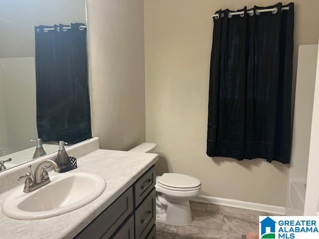 bathroom with vanity and toilet