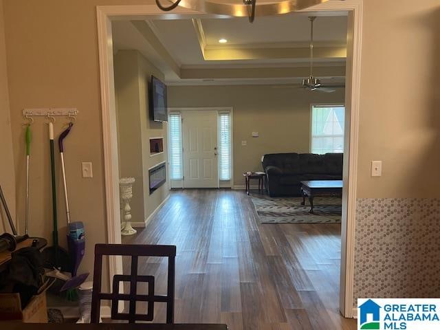 entryway featuring ceiling fan, dark hardwood / wood-style flooring, and ornamental molding