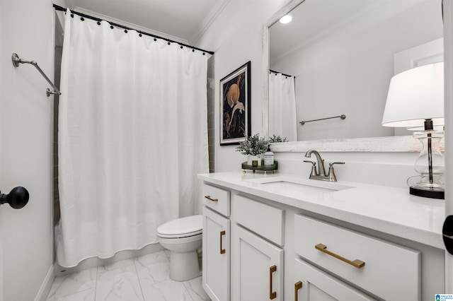 bathroom with toilet, vanity, and ornamental molding