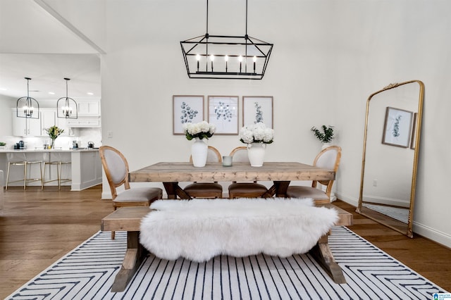 dining space with dark hardwood / wood-style flooring