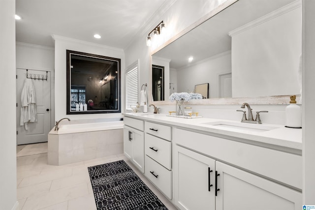 bathroom with tile patterned floors, tiled tub, vanity, and ornamental molding