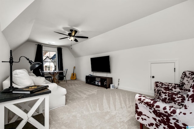 carpeted living room featuring ceiling fan and lofted ceiling