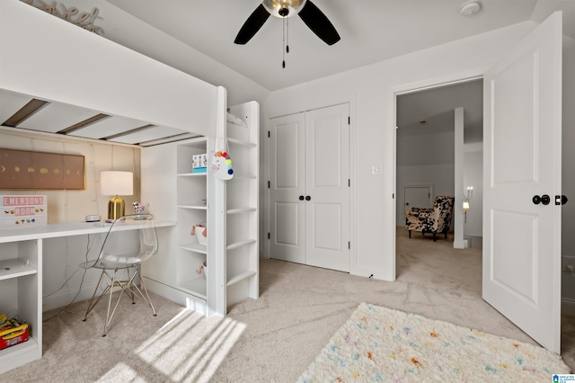 bedroom featuring ceiling fan and light colored carpet