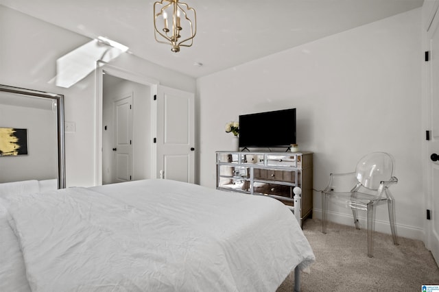 bedroom featuring light carpet and a chandelier