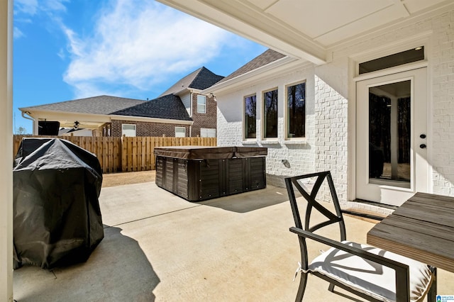 view of patio with a hot tub