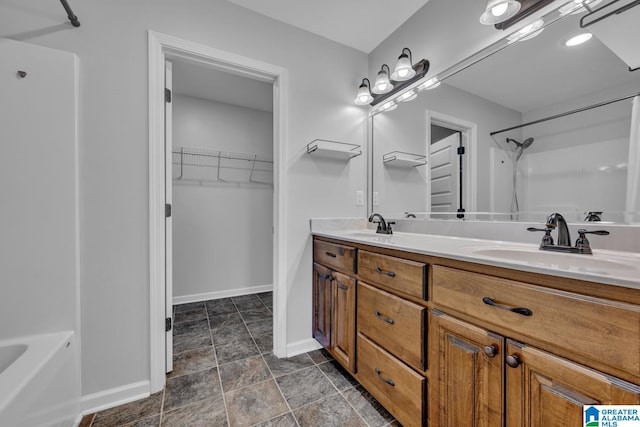 bathroom with shower / bathing tub combination and vanity