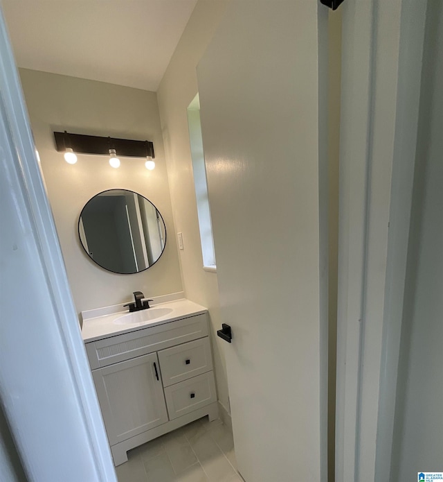 bathroom featuring tile patterned floors and vanity