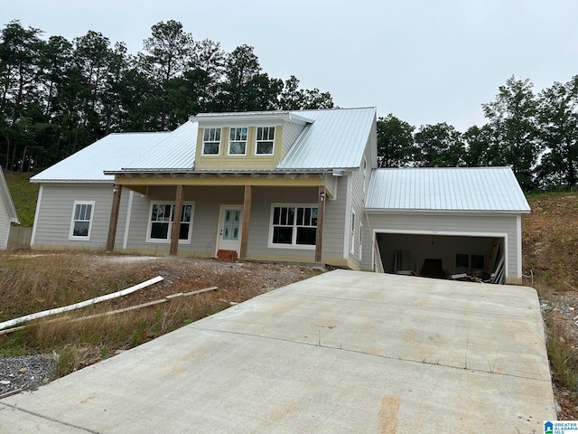 view of front of house featuring a porch and a garage