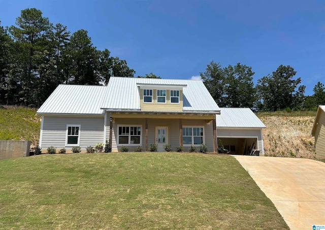 view of front of home featuring a front yard and a garage