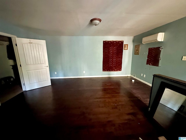 empty room with dark hardwood / wood-style flooring and an AC wall unit