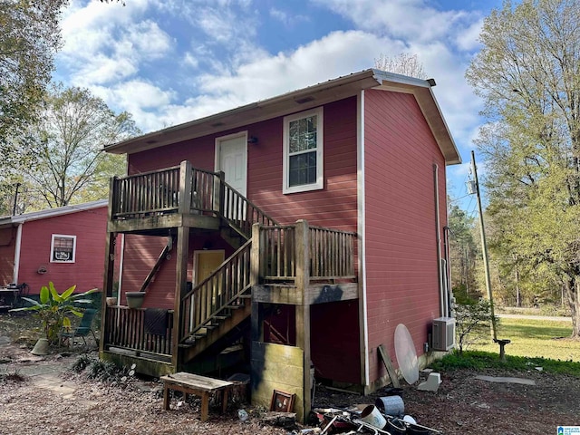 back of house featuring central air condition unit