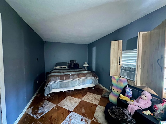 bedroom featuring cooling unit and lofted ceiling