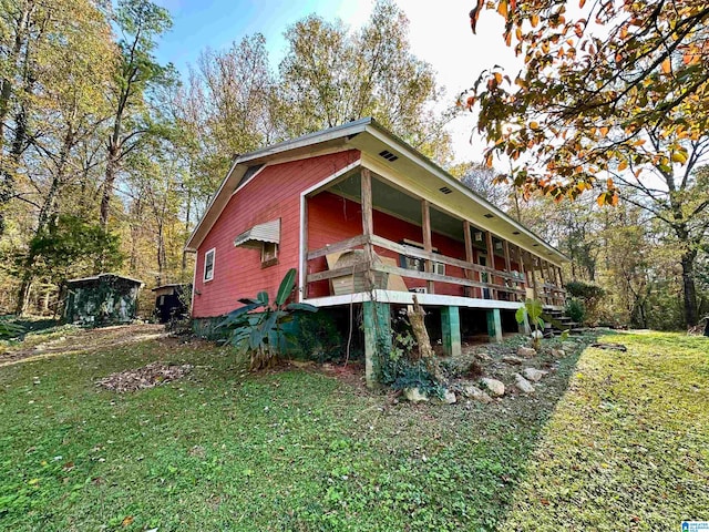 view of home's exterior with a lawn