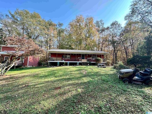 view of front facade with a front yard and a porch