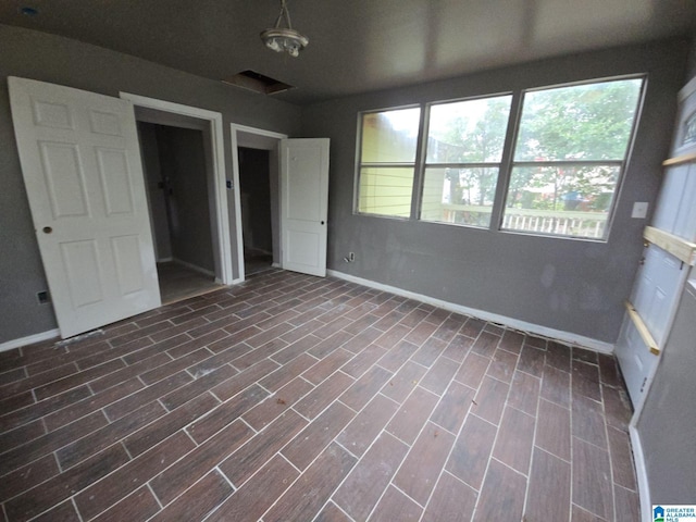 8035 4th Ave S, Birmingham, AL 35206 - unfurnished bedroom featuring multiple windows and baseboards