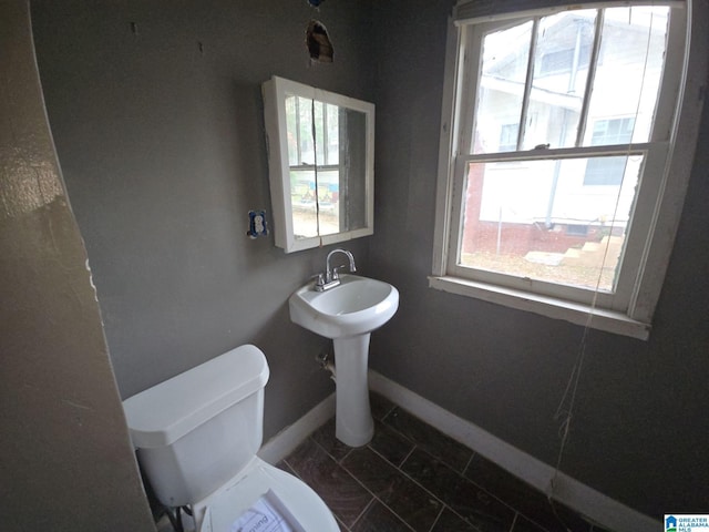 8035 4th Ave S, Birmingham, AL 35206 - half bathroom featuring toilet and baseboards