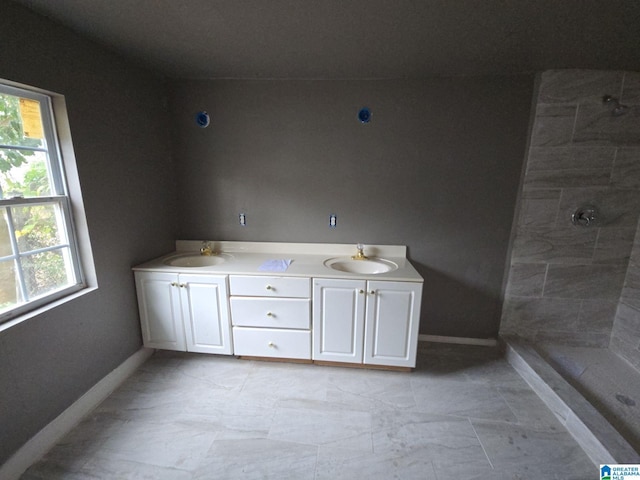 8035 4th Ave S, Birmingham, AL 35206 - full bath with baseboards, a tile shower, and double vanity