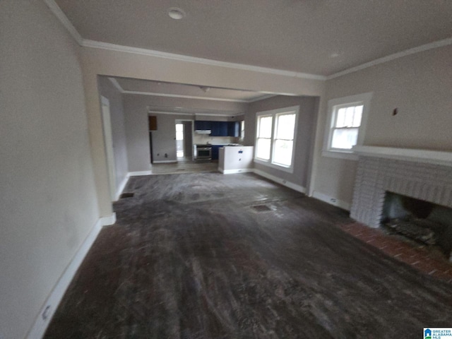 8035 4th Ave S, Birmingham, AL 35206 - unfurnished living room with ornamental molding, baseboards, a fireplace, and wood finished floors