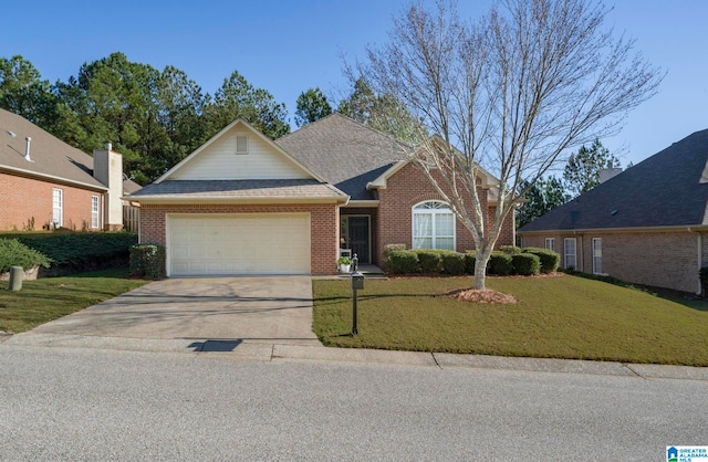 view of front of property featuring a garage and a front yard