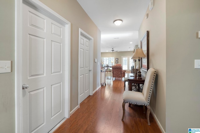 hallway with wood-type flooring