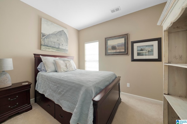 bedroom with light colored carpet