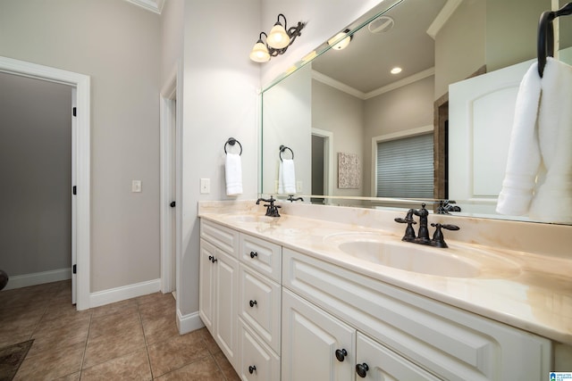 bathroom featuring tile patterned flooring, vanity, and ornamental molding