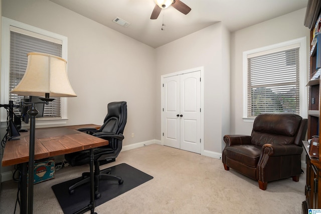 office featuring ceiling fan and light carpet