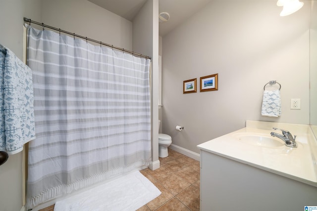 bathroom with tile patterned floors, vanity, and toilet