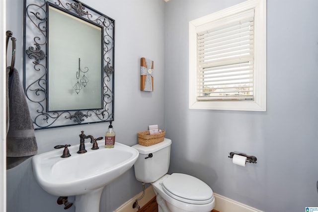 bathroom with toilet and sink