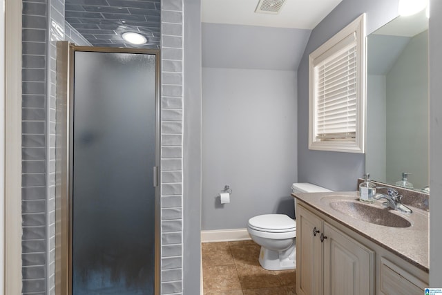 bathroom with vanity, a shower with door, vaulted ceiling, tile patterned flooring, and toilet