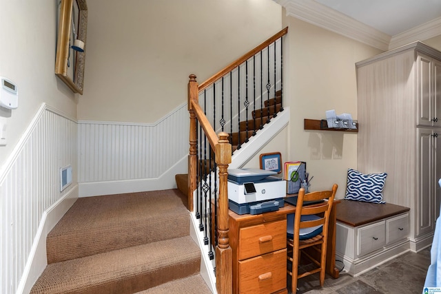 stairs featuring crown molding