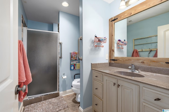 bathroom with toilet, vanity, and walk in shower