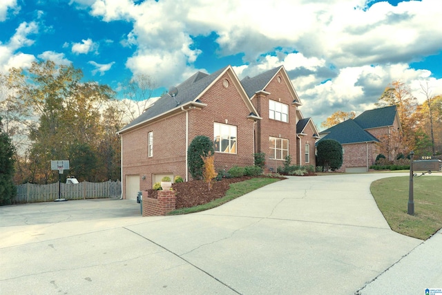 view of front facade with a front yard and a garage