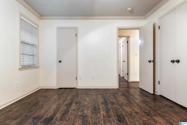 unfurnished bedroom with dark hardwood / wood-style floors and crown molding