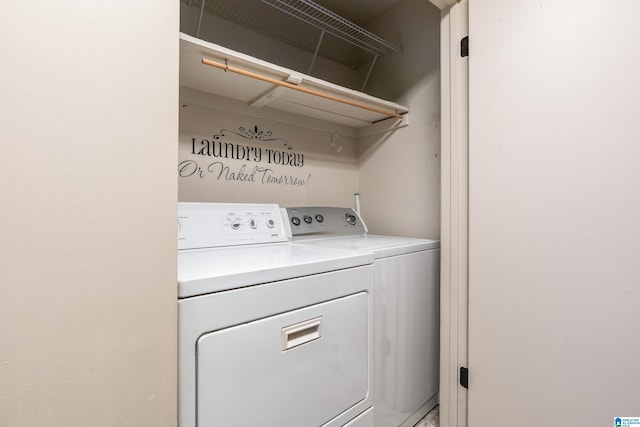 laundry room with washing machine and clothes dryer