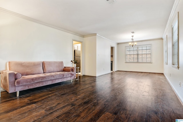 living room featuring a notable chandelier, dark hardwood / wood-style floors, and ornamental molding