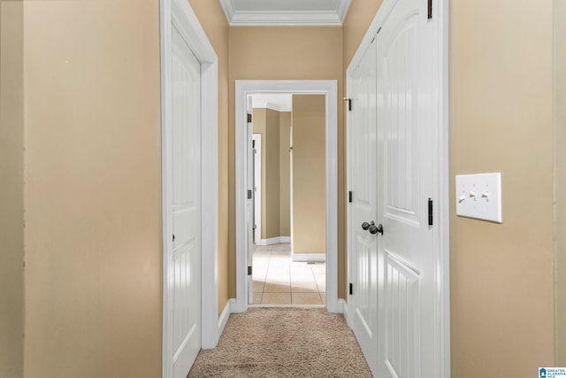 hall featuring light colored carpet and ornamental molding