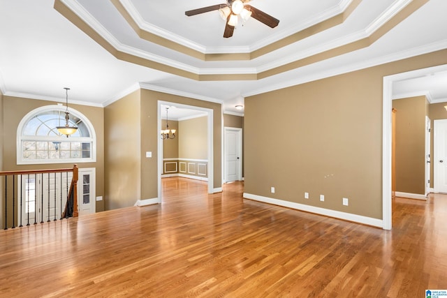 175 Smithfield Ln, Springville, AL 35146 - spare room with a ceiling fan, ornamental molding, wood finished floors, a chandelier, and a raised ceiling