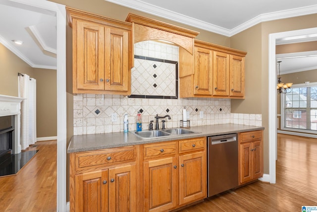 175 Smithfield Ln, Springville, AL 35146 - kitchen with dishwasher, a sink, wood finished floors, a chandelier, and crown molding