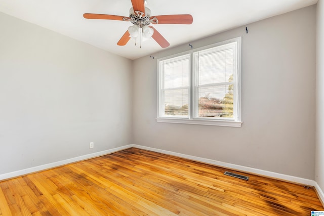 spare room featuring ceiling fan and light wood-type flooring