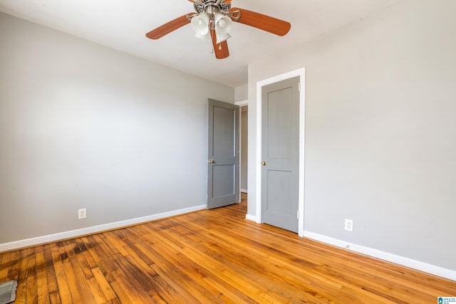 unfurnished room with ceiling fan and light hardwood / wood-style floors