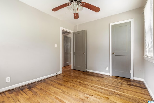 unfurnished bedroom with ceiling fan and light hardwood / wood-style floors