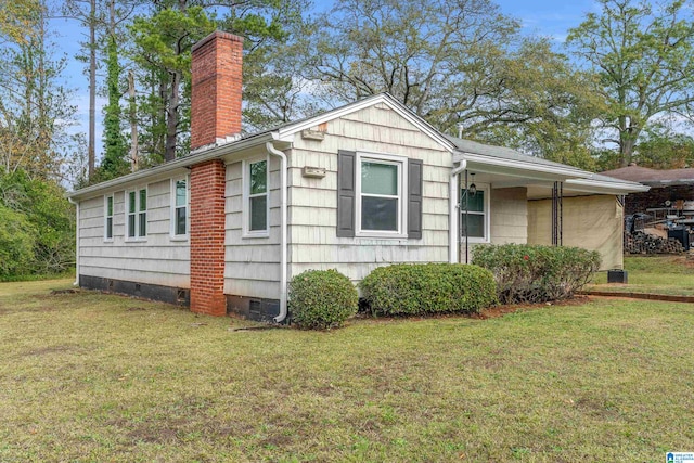 view of property exterior with a lawn