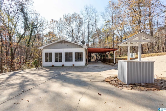 view of home's exterior featuring a carport