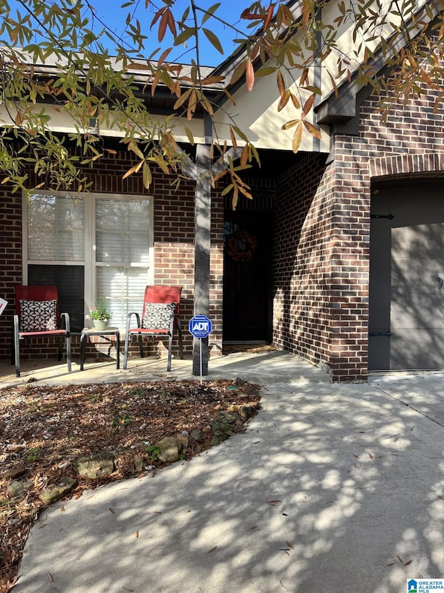 property entrance with a patio area