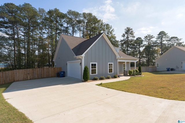 view of front of house featuring a front yard and a garage