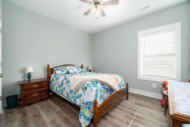 bedroom featuring ceiling fan and wood-type flooring