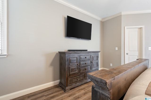 living room with hardwood / wood-style floors and ornamental molding