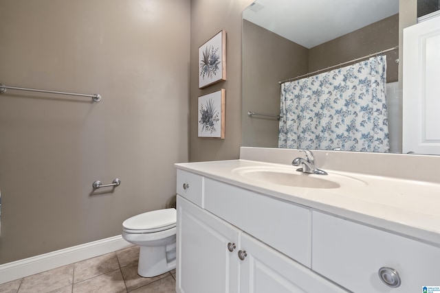 bathroom with a shower with curtain, tile patterned flooring, vanity, and toilet