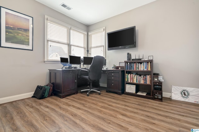 office with hardwood / wood-style flooring